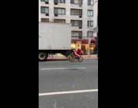Santa elf and Grinch ride bike street
