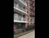 Cables seen plugged into car from balcony 