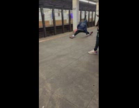 Person does splits and stretches at subway station