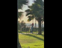 Woman red hair blue outfit tiktok dance bench 