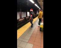 Sports jersey jean jacket santa hat dancing subway