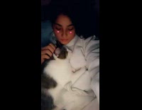 Cat girl in bed cuddle after shower