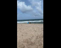 Man rides small beach wave and fall