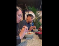 Couple gives food exchanges with each other