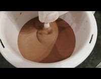 Chocolate mixed in machine white bucket satisfying