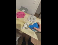 Milk in carton poured misses the mug