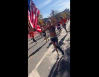 One leg woman does pushups during marathon  