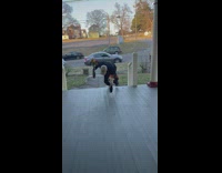 Guy trips on porch with flowers 