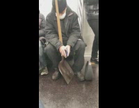 Collab Subway Creatures - Guy rides train with head on shovel 