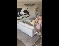 Couple rearrange couch into Christmas movie nest