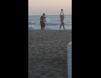 Black bikini girl kettlebell workout beach sunset