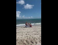 Girl wears vagina mask beach zebra print 