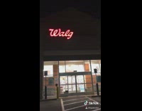 Blinking walgreens sign couple reads