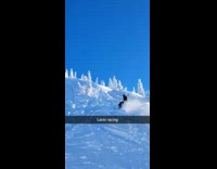 Snowmobile Ascends Snowy Slope then Tumbles Over 