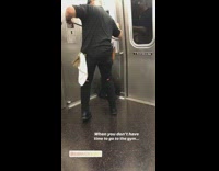 Guy uses resistance bands to do bicep curls on subway train