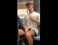 Guy white shirt dances and chest pops on subway train