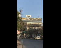 Building Gold gym sign shimmers with sunlight