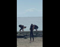 Couple does yoga pose beach ledge picture