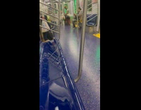Woman use vacuum inside the subway train