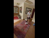 Guy moves finger in circle dog spins