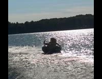 Woman on tube pulled by boat flipped