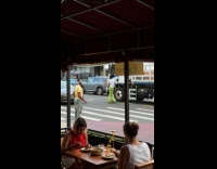 Man on skate shoes dance act like traffic enforcer