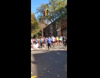 Filmer reacts to the crowd at Marathon