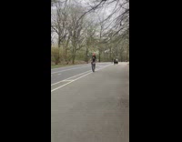Guy Wearing American Flag Shorts Rides Unicycle 