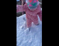 Kid falls first time walking on snow