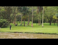 Girl pink dress crossed leg selfie river