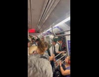 Irish marching band gets off from subway train