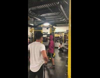 Guy does monkey bar pull ups and hits head on rail at the gym
