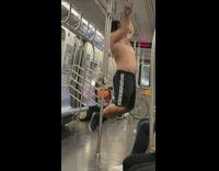 Man Does Push Up in Subway Train
