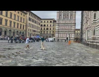 Woman in cyan top modeled near the cathedral