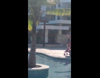 Man with baby takes picture of woman