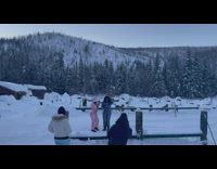 Man and woman in pink and blue jacket photoshoot