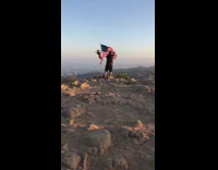 Girl climb pole american flag mountain independence day