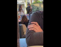 Two young girls tiktok dance restaurant patio 