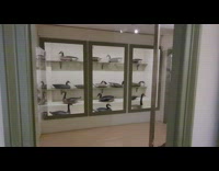 Wooden hunt decoy ducks and a boat inside the house