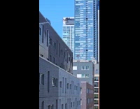 WIndow washers using drones to clean building windows 