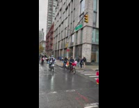 Motorcade on the street with bikes, scooters, and motorcycles