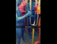 women painted in different colors stand by one another 