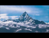 Time lapse Fishtail mountain summit with clouds