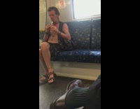 Man opened vest body plays flute train 