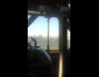 Motorcycle riders do wheelie on bridge 