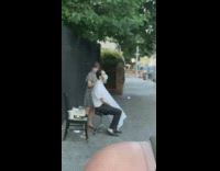 Grey dress girl haircut sidewalk guy cape