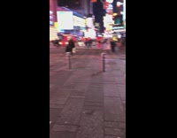 Shirtless buff guy with scary mask and speakers walks by trash can that says dont be afraid of anyone