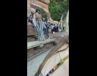 Woman in striped pants poses 