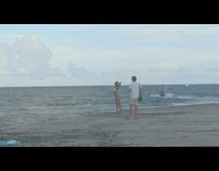 Woman yellow bikini drone jet ski beach