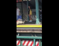 Man do exercise at the train station in the morning 